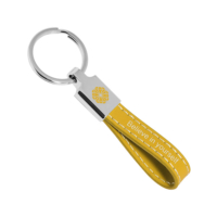 Letters and text are digitally printed on a leather keychain.